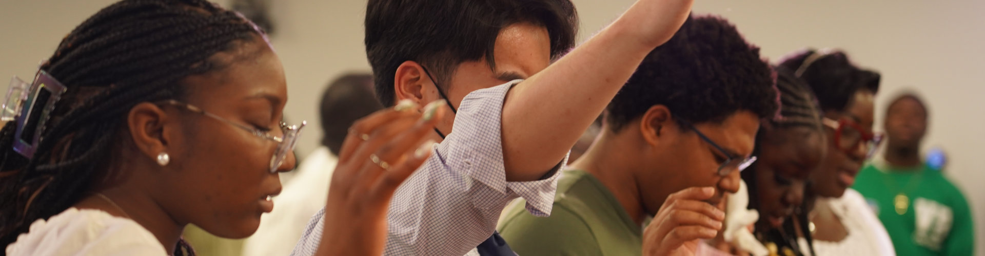 a group of pepople praying